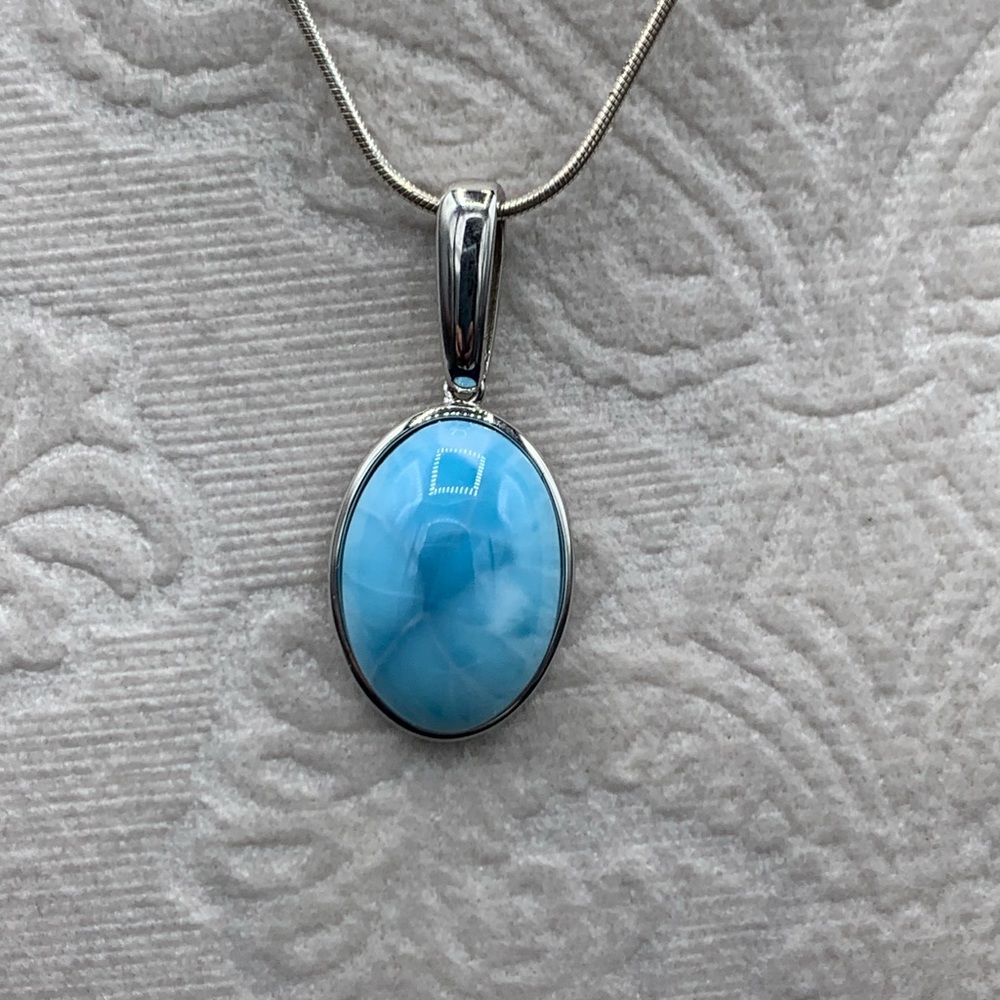 Larimar Gemstone set in Sterling Silver with a silver chain. Rare and popular.